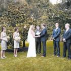 Lucinda Borrie and Chris Garside exchange vows at Grandview Gardens in Febraury. Photo by Kerry...