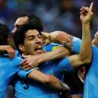 Luis Suarez celebrates with teammates after scoring Uruguay's first goal against England. REUTERS...