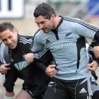 Luke McAlister, left and Stephen Donald at the All Blacks rugby training at Carisbrook, as they...