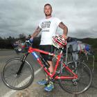 Luke O'Malley stops near Outram to visit family yesterday, as part of his cycling mission from...
