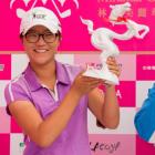Lydia Ko poses with the trophy after her win. Photo Getty Images