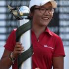 Lydia Ko poses with the trophy after winning the New Zealand Women's Open at Clearwater Golf...