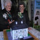 Lynda Snell (84) and Ruth Telford (84) cut the cake at the opening of Telford: the Golden Years...