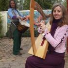 Lynley Caldwell plays her harp while Ra McRostie practices her drumming. Photo by Sally Rae.