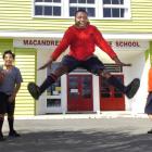M-slaks hip-hop team member Marvelous Bamgbose (13) jumps for joy, watched by (from left) Isaac...
