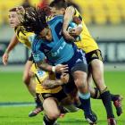 Ma'a Nonu of the Blues is tackled during the round 11 Super Rugby match between the Hurricanes...