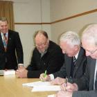 Mackenzie Mayor John O'Neill (right) and Waitaki Mayor Alex Familton sign a $2.75 million...