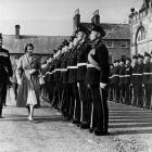Major Dermot Neill, father of actor Sam Neill, inspects the troops with a young Queen Elizabeth...