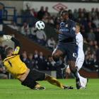 Manchester City's Gnegneri Toure Yaya, right, is denied by Blackburn Rovers goalkeeper Paul...