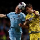 Manchester City's James Milner (L) challenges Sheffield Wednesday's Lewis Buxton during their...