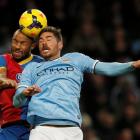 Manchester City's Javi Garcia (R) and Crystal Palace's Danny Gabbidon contest the ball. REUTERS/Phil