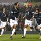 Manchester City's Joleon Lescott celebrates after scoring against Aston Villa. (AP Photo/Jon Super)