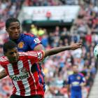 Manchester United's Antonio Valencia (back) challenges Sunderland's Patrick van Aanholt. REUTERS...