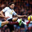 Manchester United's Daley Blind (R) challenges West Ham United's Stewart Downing during their...