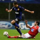 Manchester United's Javier Hernandez (L) is challenged by Braga's Nuno Andre Coelho during their...
