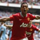 Manchester United's Nani celebrates after scoring against Manchester City during their English FA...