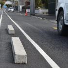 Many of the concrete kerb blocks were removed from Coughtrey St yesterday, with large chunks of...