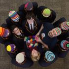 Marcus Schulz (centre, right), of Germany, shows John McGlashan College German teacher Anna Noble...
