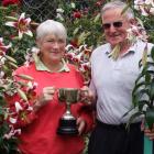 Margaret Muir and John Hill in their Momona garden amid a patch of Leslie Woodriff lilies. Mr...