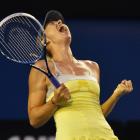 Maria Sharapova of Russia celebrates defeating Venus Williams of the US in their women's singles...