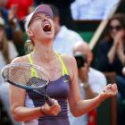 Maria Sharapova of Russia celebrates defeating Victoria Azarenka of Belarus in their women's...