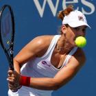 Marina Erakovic of New Zealand hits a return ball to Petra Kvitova of the Czech Republic at the...