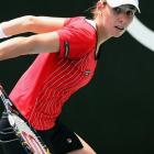 Marina Erakovic, of New Zealand, plays a backhand during her match against Nuria Llagostera Vives...