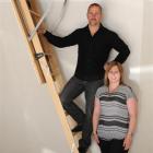 Mark and Hayley McHutchon from Otago Skylights and Heating demonstrate the use of attic stairs at...