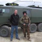 Mark Foster (left) and son Private Daniel Foster  with a Light Operational Vehicle (LOV) at the...
