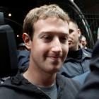 Mark Zuckerberg is escorted by security guards as he leaves New York City's Sheraton Hotel....