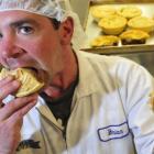Marlow Pies production manager Brian Taylor tucks into an English-themed bangers and mash pie...