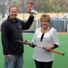 Martin Glossop and Helen Napier have been honoured for their contributions to hockey officiating....