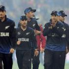 Martin Guptill leads New Zealand off the field after their win over the West Indies in in...