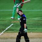 Martin Guptill of New Zealand celebrates after scoring a century during the 2015 ICC Cricket...