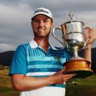 Matthew Griffin poses with the trophy after his victory in the New Zealand Open. Photo Getty Images