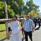 Max Whitaker leads the North Dunedin Walk of the Cross through the Dunedin Botanic Garden...