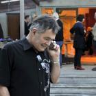 Mayor elect Dave Cull takes a call from a well-wisher. Photo by Gerard O'Brien