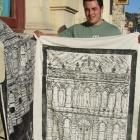 Damien McNamara holds one of his woodcuts outside the Connell and Clowes building in Tyne St....