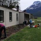 Members of the Heritage Rose Society and the Wakatipu Garden Club plant out part of the Paradise...