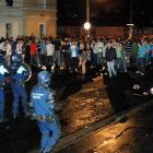 Members of the police riot squad clash with the crowd in Castle St yesterday morning. Photo by...