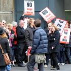Members of the Service and Food Workers Union picket Dunedin  Hospital yesterday. Photo by Peter...