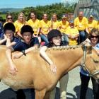 Members of the Wanaka Riding for the Disabled team introduce themselves to Owaka horse Throwa at...