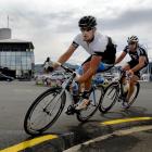 Men's winner Mark Ryan, of Timaru, leads runner-up Glen Thomson, of Invercargill, through a bend....