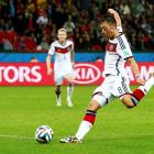 Mesut Ozil takes a kick against Algeria during extra time. REUTERS/Darren Staples