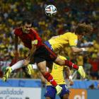 Mexico's Rafael Marquez (left) fights for the ball with Brazil's David Luiz during their 2014...