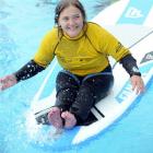 Mia O'Keefe (19), of Dunedin, paddles at the  Flight Centre Foundation Halberg Surf Programme at...