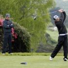 Michael Minty (St Clair) watches as Cody Harper (Southland) drives off the first tee at the Otago...