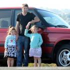Mike Rankin, with his daughters Mikaela (5, left) and Jasmine (7), and his just-received 1996...