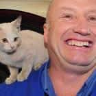 Mike Teasdale, of Mike Teasdale Motors, Dunedin, with the stray kitten which hitched a ride to...