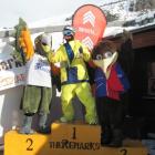 Milu Ma, of Queenstown, winner of the TRIC men's open snowboard division, takes to the podium...